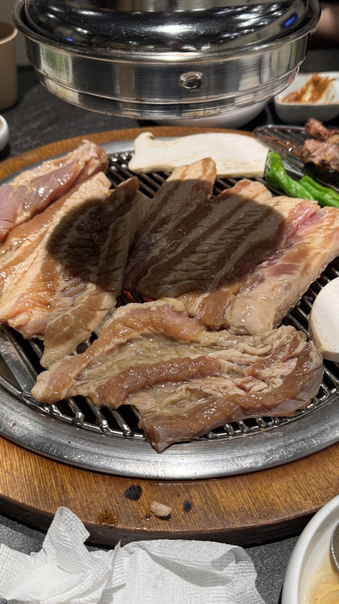 Fresh raw pork ribs on charcoal grill at Gilchon Busan